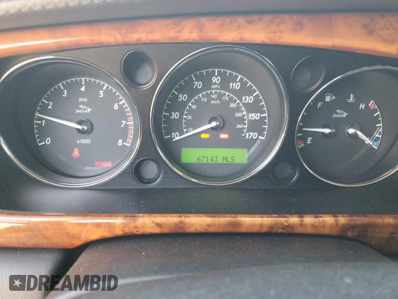 2009 Jaguar XJ 8 with VIN SAJWA71B79SH30431, listed as a Copart auction lot 52403185 with 67,143 mi miles and Salvage Title. Bid and sale history available at DreamBid. Image 9.