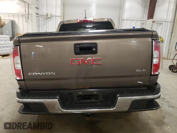 2015 GMC Canyon 4WD SLE z VIN 1GTG6BE3XF1242163, wystawiony jako Copart lot #57132035 z przebiegiem 110 241 mil mil oraz Szkoda całkowita • Salvage title. Historia ofert i sprzedaży dostępna na DreamBid. Obrazek 6.