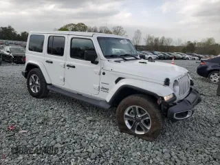2019 Jeep Wrangler Unlimited Sahara with VIN 1C4HJXEG5KW602598, listed as a Copart auction lot 51666055 with 75,782 mi miles and Salvage Title. Bid and sale history available at carsss.com. Image 4.