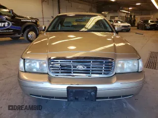 2000 Ford Crown Victoria LX z VIN 2FAFP74WXYX116130, wystawiony jako Copart lot #79441204 z przebiegiem 128 133 mil mil oraz Szkoda całkowita • Salvage title. Historia ofert i sprzedaży dostępna na DreamBid. Obrazek 5.