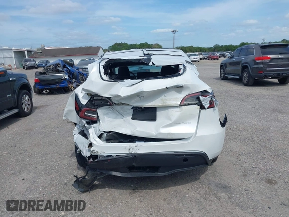 2023 Tesla Model Y Long Range with VIN 7SAYGDEE3PA206757, listed as a IAAI auction lot 39425483 with 5,711 mi miles and . Bid and sale history available at DreamBid. Image 16.