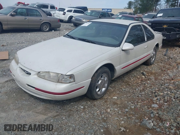 1997 Ford Thunderbird LX z VIN 1FALP62W6VH142784, wystawiony jako IAAI lot #41792883 z przebiegiem 244 300 mil mil oraz . Historia ofert i sprzedaży dostępna na DreamBid. Obrazek 2.
