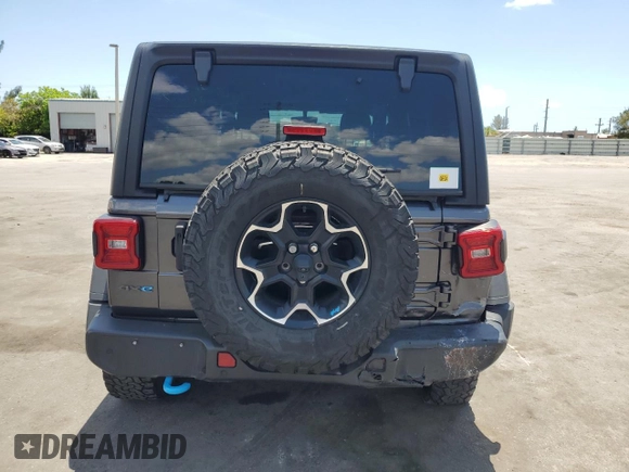 2023 Jeep Wrangler Rubicon z VIN 1C4JJXR65PW557849, wystawiony jako Copart lot #57845705 z przebiegiem 21 849 mil mil oraz Szkoda całkowita • Salvage title. Historia ofert i sprzedaży dostępna na DreamBid. Obrazek 6.