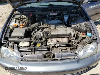 1995 Honda Civic LX z VIN 1HGEG8665SL054389, wystawiony jako Copart lot #70983094 z przebiegiem 195 047 mil mil oraz Szkoda całkowita • Salvage title. Historia ofert i sprzedaży dostępna na DreamBid. Obrazek 13.