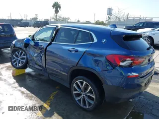2022 BMW X2 xDrive28i z VIN WBXYJ1C02N5U85241, wystawiony jako IAAI lot #41965012 z przebiegiem 36 262 mil mil oraz . Historia ofert i sprzedaży dostępna na DreamBid. Obrazek 3.