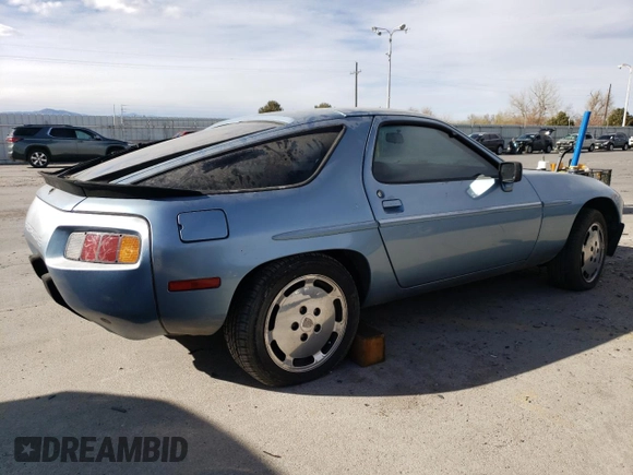 1985 Porsche 928 z VIN WP0JB092XFS860634, wystawiony jako Copart lot #49650775 z przebiegiem 140 644 mil mil oraz Czysty tytuł • Clean title. Historia ofert i sprzedaży dostępna na DreamBid. Obrazek 3.