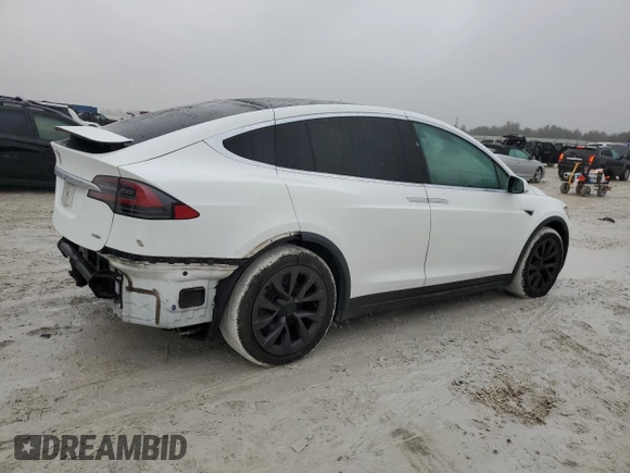 2017 Tesla Model X 90D z VIN 5YJXCBE22HF076134, wystawiony jako Copart lot #41828555 z przebiegiem 214 443 mil mil oraz Szkody całkowita. Historia ofert i sprzedaży dostępna na DreamBid. Obrazek 3.