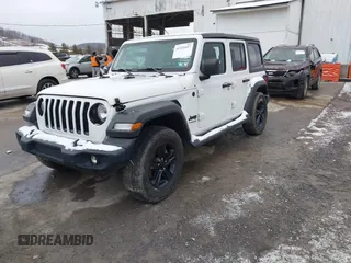 2021 Jeep Wrangler Unlimited Sport Altitude with VIN 1C4HJXDG2MW791599, listed as a IAAI auction lot 41235427 with 47,220 mi miles and . Bid and sale history available at DreamBid. Image 2.