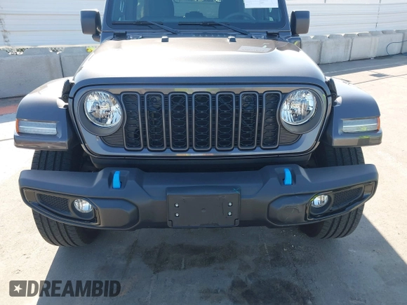 2024 Jeep Wrangler Sport S with VIN 1C4RJXN61RW192386, listed as a IAAI auction lot 42001810 with 7,426 mi miles and . Bid and sale history available at DreamBid. Image 12.