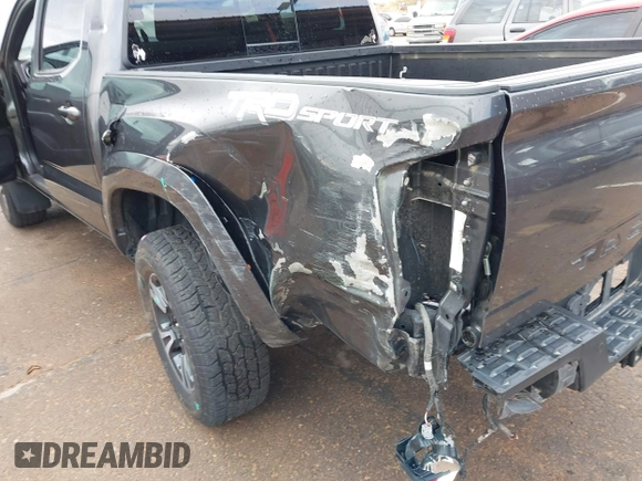 2018 Toyota Tacoma SR5 with VIN 3TMAZ5CN0JM061233, listed as a IAAI auction lot 41944668 with 94,314 mi miles and . Bid and sale history available at DreamBid. Image 6.