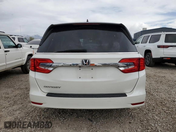 2018 Honda Odyssey EX-L with VIN 5FNRL6H71JB059936, listed as a Copart auction lot 53403635 with 94,745 mi miles and Salvage Title. Bid and sale history available at DreamBid. Image 6.