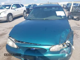 1997 Ford Escort LX z VIN 3FALP15P7VR158272, wystawiony jako IAAI lot #41833216 z przebiegiem 148 170 mil mil oraz . Historia ofert i sprzedaży dostępna na DreamBid. Obrazek 11.