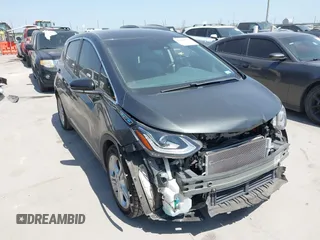 2019 Chevrolet Bolt EV LT z VIN 1G1FY6S04K4101498, wystawiony jako IAAI lot #42010573 z przebiegiem 93 456 mil mil oraz . Historia ofert i sprzedaży dostępna na DreamBid. Obrazek 1.