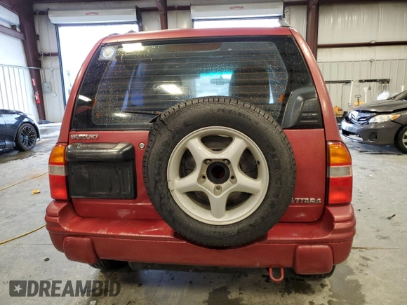 1999 Suzuki Vitara JLS z VIN 2S3TE52V6X6110719, wystawiony jako Copart lot #44219825 z przebiegiem 190 311 mil mil oraz Szkoda całkowita • Salvage title. Historia ofert i sprzedaży dostępna na DreamBid. Obrazek 6.