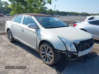 2013 Cadillac XTS Luxury with VIN 2G61P5S34D9191733, listed as a IAAI auction lot 42318119 with 129,379 mi miles and . Bid and sale history available at DreamBid. Image 1.