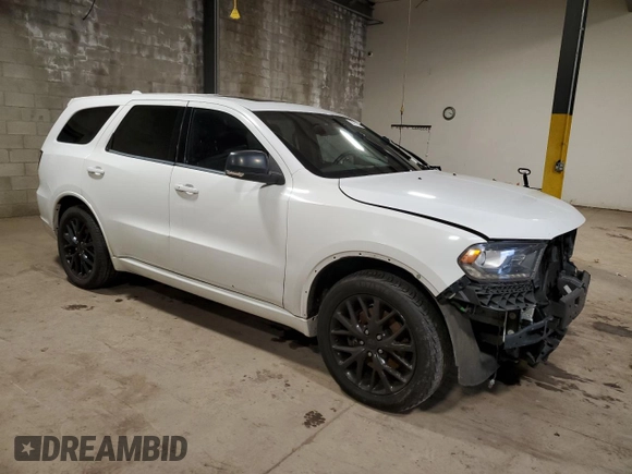 2015 Dodge Durango R/T with VIN 1C4SDHCTXFC916712, listed as a Copart auction lot 87113784 with 120,950 mi miles and Salvage Title. Bid and sale history available at DreamBid. Image 4.