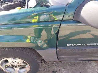 1997 Jeep Grand Cherokee Laredo with VIN 1J4GZ58S2VC595442, listed as a IAAI auction lot 41772133 with 229,764 mi miles. Bid and sale history available at carsss.com. Image 13.