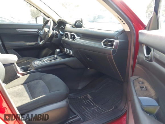 2019 Mazda CX-5 Sport with VIN JM3KFABM0K1633065, listed as a IAAI auction lot 41968786 with 90,407 mi miles and . Bid and sale history available at DreamBid. Image 5.