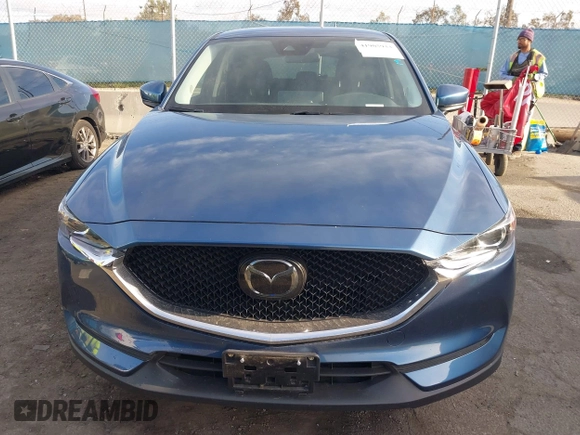 2021 Mazda CX-5 Touring with VIN JM3KFACM5M0332718, listed as a IAAI auction lot 41905933 with 30,930 mi miles. Bid and sale history available at carsss.com. Image 13.