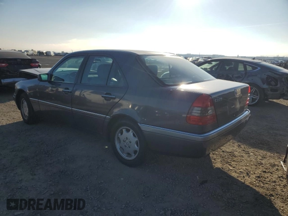 1997 Mercedes-Benz C with VIN WDBHA23E7VF545229, listed as a Copart auction lot 43518335 with 153,158 mi miles and Salvage title. Bid and sale history available at DreamBid. Image 2.