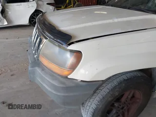 2000 Jeep Grand Cherokee Laredo with VIN 1J4G248S7YC363891, listed as a IAAI auction lot 42715393 with 238,686 mi miles and . Bid and sale history available at DreamBid. Image 6.