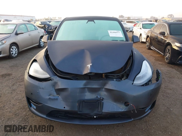2021 Tesla Model Y Standard Range z VIN 5YJYGDED4MF121963, wystawiony jako IAAI lot #41490477 z przebiegiem 41 941 mil mil oraz . Historia ofert i sprzedaży dostępna na DreamBid. Obrazek 12.