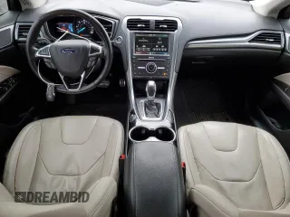 2016 Ford Fusion Titanium Hybrid with VIN 3FA6P0RU7GR187877, listed as a Copart auction lot 88923615 with 76,322 mi miles and Salvage Title. Bid and sale history available at carsss.com. Image 8.