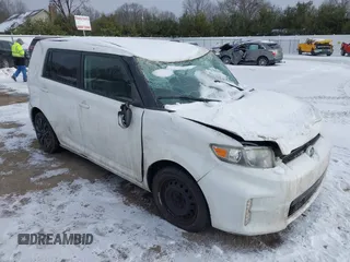 2013 Scion xB with VIN JTLZE4FE2DJ034562, listed as a IAAI auction lot 41311255 with 100,454 mi miles. Bid and sale history available at carsss.com. Image 1.