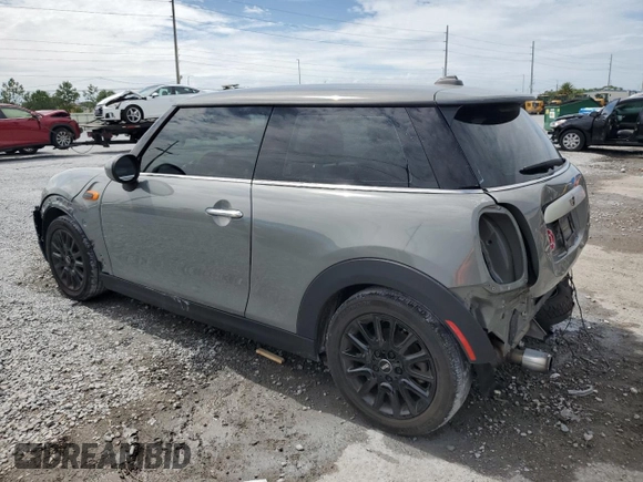 2014 MINI Hardtop with VIN WMWXM5C51ET934047, listed as a Copart auction lot 63039335 with 104,446 mi miles and Salvage title. Bid and sale history available at DreamBid. Image 2.