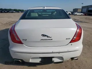 2014 Jaguar XJ Supercharged z VIN SAJWA1GT4EMV60053, wystawiony jako Copart lot #57643005 z przebiegiem 48 139 mil mil oraz Szkoda całkowita • Salvage title. Historia ofert i sprzedaży dostępna na DreamBid. Obrazek 6.