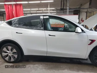 2023 Tesla Model Y Long Range with VIN 7SAYGDEE7PA100523, listed as a IAAI auction lot 40399455 with 18,885 mi miles and . Bid and sale history available at DreamBid. Image 13.