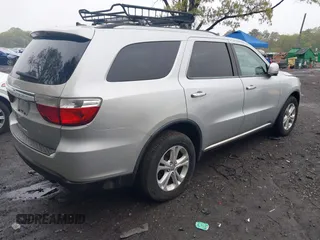 2013 Dodge Durango Crew with VIN 1C4SDJDT8DC565608, listed as a IAAI auction lot 42181773 with 161,485 mi miles and . Bid and sale history available at DreamBid. Image 4.