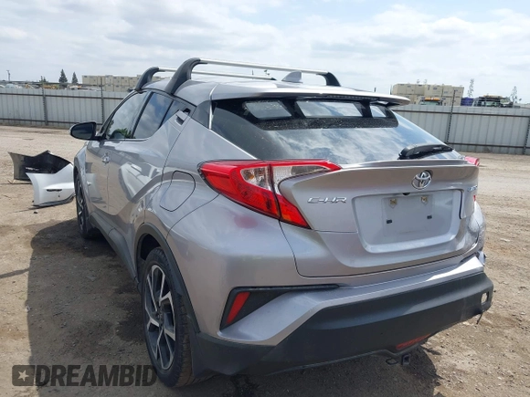 2019 Toyota C-HR XLE with VIN JTNKHMBX3K1016723, listed as a IAAI auction lot 42040571 with 158,804 mi miles. Bid and sale history available at carsss.com. Image 3.