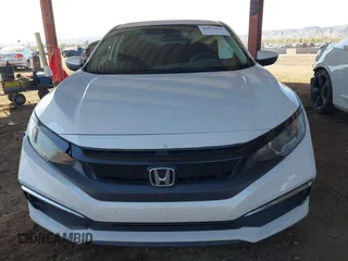 2020 Honda Civic LX with VIN 19XFC2F66LE007328, listed as a IAAI auction lot 41852111 with 135,956 mi miles and . Bid and sale history available at DreamBid. Image 12.