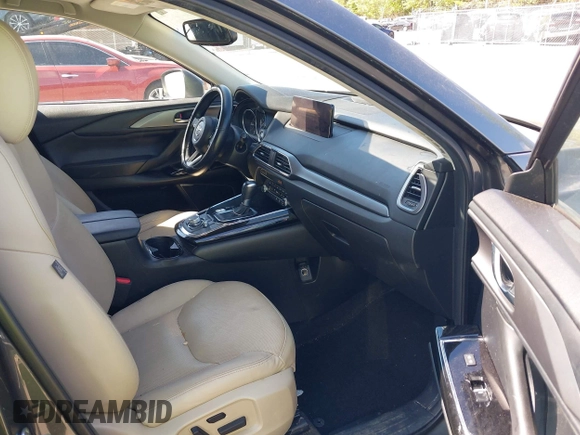 2021 Mazda CX-9 Touring with VIN JM3TCACY7M0503484, listed as a IAAI auction lot 42013262 with 63,777 mi miles and . Bid and sale history available at DreamBid. Image 5.