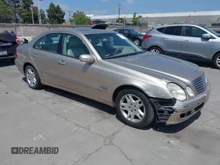 2003 Mercedes-Benz E-Class 3.2L with VIN WDBUF65JX3A236768, listed as a IAAI auction lot 42094824 with 251,896 mi miles. Bid and sale history available at carsss.com. Image 1.