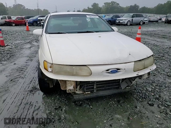 1994 Ford Taurus GL z VIN 1FALP52U5RA152732, wystawiony jako Copart lot #70472324 z przebiegiem 52 781 mil mil oraz Szkoda całkowita • Salvage title. Historia ofert i sprzedaży dostępna na DreamBid. Obrazek 11.