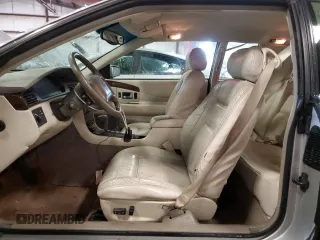 1999 Cadillac Eldorado z VIN 1G6EL12Y1XU611974, wystawiony jako Copart lot #71761494 z przebiegiem 139 494 mil mil oraz Czysty tytuł • Clean title. Historia ofert i sprzedaży dostępna na DreamBid. Obrazek 7.