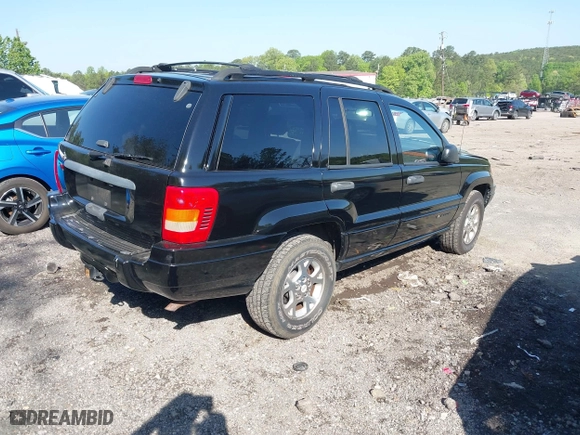 1999 Jeep Grand Cherokee Laredo with VIN 1J4GW58S5XC687480, listed as a IAAI auction lot 42016415 with 186,776 mi miles. Bid and sale history available at carsss.com. Image 4.