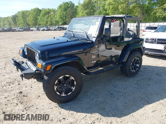 2004 Jeep Wrangler Sahara with VIN 1J4FA59S74P801296, listed as a IAAI auction lot 42049291 with 152,208 mi miles and . Bid and sale history available at DreamBid. Image 2.