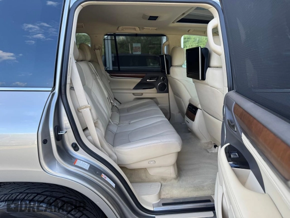 2016 Lexus LX 570 with VIN JTJHY7AX4G4198811, listed as a Copart auction lot 64898475 with 107,759 mi miles and Clean title. Bid and sale history available at DreamBid. Image 6.