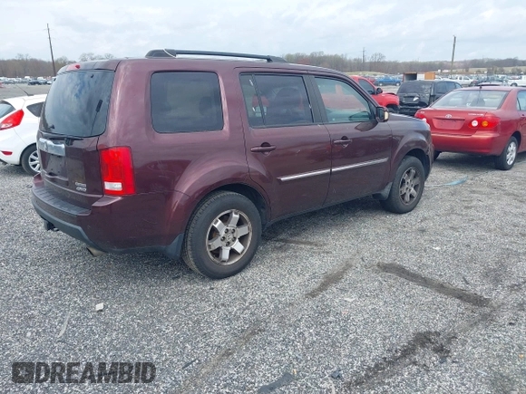 2010 Honda Pilot Touring with VIN 5FNYF4H95AB040721, listed as a IAAI auction lot 41928412 with 213,219 mi miles and . Bid and sale history available at carsss.com. Image 4.