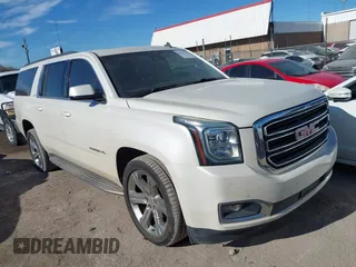 2015 GMC Yukon XL SLT with VIN 1GKS2HKC0FR179223, listed as a IAAI auction lot 40964120 with 184,592 mi miles. Bid and sale history available at carsss.com. Image 1.