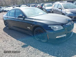 2015 BMW 7 Series 750i xDrive with VIN WBAYB6C57FD965802, listed as a IAAI auction lot 40588698 with 999,999 mi miles. Bid and sale history available at carsss.com. Image 1.
