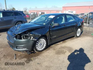 2015 Ford Fusion S Hybrid with VIN 3FA6P0UU7FR117785, listed as a IAAI auction lot 41589546 with 136,657 mi miles. Bid and sale history available at carsss.com. Image 2.