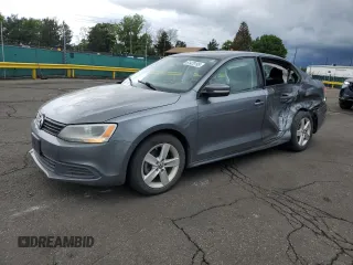 2012 Volkswagen Jetta TDI with VIN 3VWLL7AJ8CM330990, listed as a Copart auction lot 61420195 with 143,893 mi miles and Salvage title. Bid and sale history available at DreamBid. Image 1.