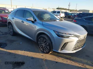 2023 Lexus RX with VIN JTJCHMAA1P2000203, listed as a IAAI auction lot 41409470 with 1 mi miles. Bid and sale history available at carsss.com. Image 1.