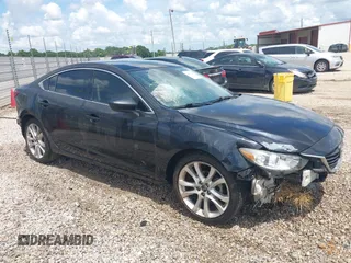 2014 Mazda 6 i Touring with VIN JM1GJ1T65E1156456, listed as a IAAI auction lot 42480187 with 196,327 mi miles and . Bid and sale history available at DreamBid. Image 1.