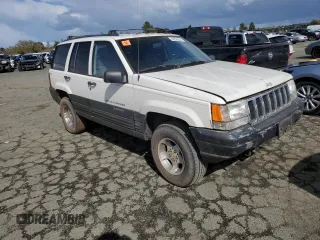 1997 Jeep Grand Cherokee Laredo with VIN 1J4GZ58S8VC647415, listed as a Copart auction lot 49258934 with 0 mi miles and Salvage Title. Bid and sale history available at carsss.com. Image 4.