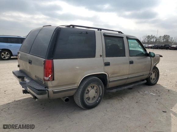 1999 Chevrolet Tahoe with VIN 1GNEC13R9XJ557532, listed as a Copart auction lot 44948845 with 215,360 mi miles and Salvage Title. Bid and sale history available at carsss.com. Image 3.